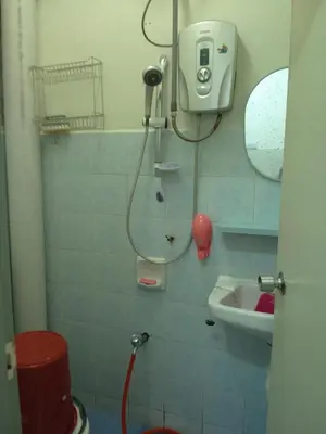 a bathroom with a shower and a sink at Cameron Highlands Muslim Apartment by AziziCameron in Cameron Highlands