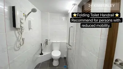a bathroom with a toilet and a sign that reads looking toilet manual recommendation for persons at 24 Kimberley in George Town