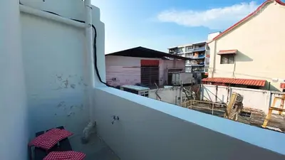 a balcony with a view of a building at 24 Kimberley in George Town