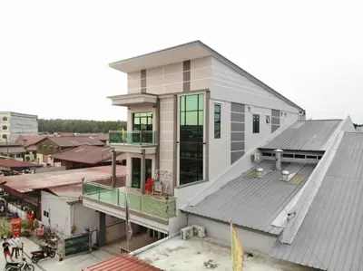 an aerial view of a house with a roof at CK Homestay K.Sepetang in Taiping