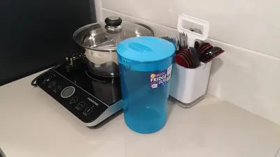 a food processor sitting on a counter next to a blender at My Home Apartment - The Quintet Condo in Cameron Highlands
