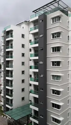 a tall white apartment building with a balcony at My Home Apartment - The Quintet Condo in Cameron Highlands