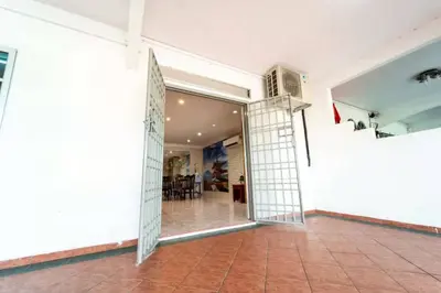 an open door to a room with a table at Star Light Homestay in Sitiawan