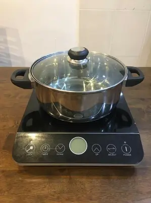 a pot sitting on top of a stove at W21 atGoldenHills NightMarket WiFi 4R in Cameron Highlands