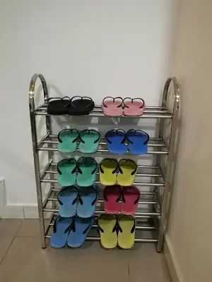 a rack with several pairs of shoes on it at W21 atGoldenHills NightMarket WiFi 4R in Cameron Highlands