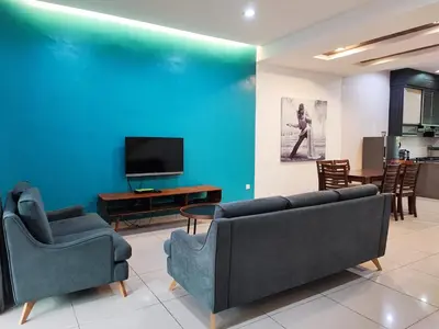 a living room with two couches and a tv at W21 atGoldenHills NightMarket WiFi 4R in Cameron Highlands