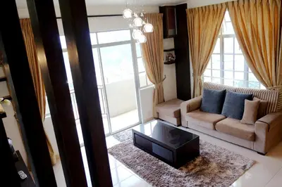 a living room with a couch and a coffee table at Cameron View Apartment @ Crown Imperial Court Brinchang in Cameron Highlands