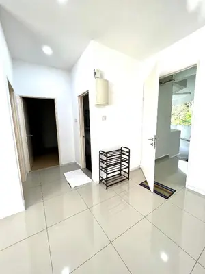 a white room with a chair on a tile floor at Home Away from Home in Taiping - 3R4B Family & Group Friendly! in Taiping