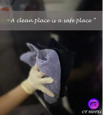 a person holding a cloth place is a safe place at Ct Hotel in Sitiawan