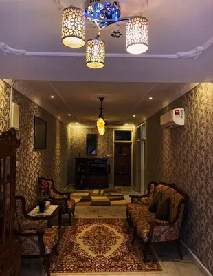 a living room with two chairs and a couch at Bayan Baru Homestay @ Taman Sri Nibong in George Town