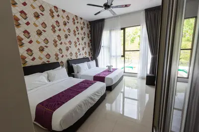 a hotel room with two beds and a window at Rock Mountain in Raub