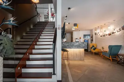 a staircase in a house with a living room at Apple Hotel Times Square in George Town