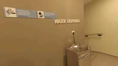 a bathroom with a water dispenser on the wall at U Design Hotel Kuala Lipis in Kuala Lipis