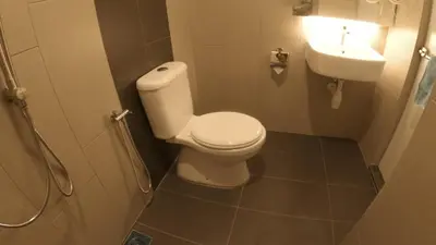 a bathroom with a toilet and a sink at U Design Hotel Kuala Lipis in Kuala Lipis