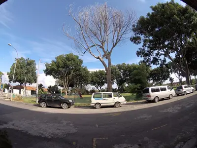 a group of cars parked on the side of a street at JV Hotel @ Bandar Tasek Mutiara in Simpang Ampat