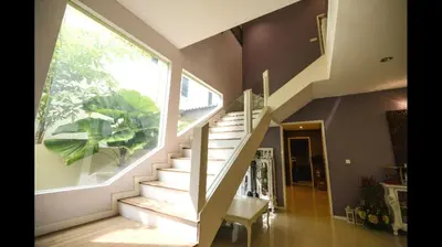 a staircase in a house with a large window at The heaven in sunway ipoh in Ipoh