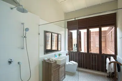a bathroom with a sink and a toilet and a shower at Noordin Mews in George Town