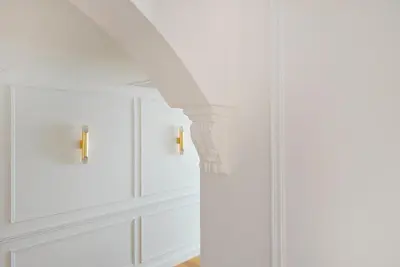 a white kitchen with white cabinets and a white ceiling at White Mansion Penang in George Town