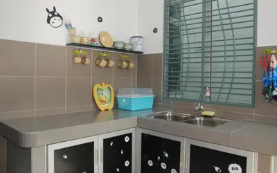 a kitchen with a sink and a counter top at Qstay Sitiawan Townhouse (Totoro Dreams) - \u68a6\u89c1\u9f99\u732b in Sitiawan