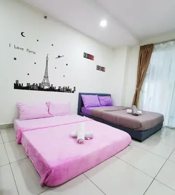 two beds in a room with pink sheets at Mansion One by Sky Hive in George Town