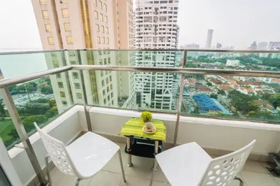 a balcony with a table and chairs in a building at Mansion One by Sky Hive in George Town