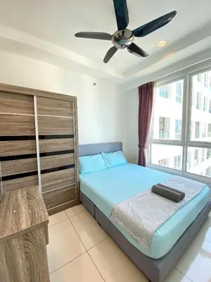 a bedroom with a bed and a ceiling fan at Mansion One by Sky Hive in George Town