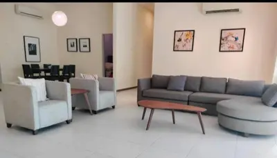 a living room with a couch and chairs and a table at Sekinchan HighView Penthouse 15pax 5R5B \u9876\u5c42\u516c\u5bd3 \u770b\u6d77 \u770b\u7a3b\u7530\u666f in Sekincan