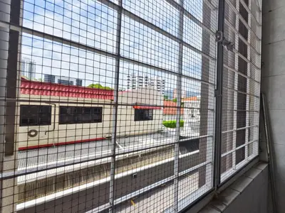 a view of a train through a window at 3 Concordia @ Gurney in George Town