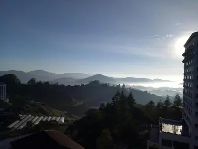 a view of the mountains from a building at Fun Apartment @ Equatorial Hill Resort in Cameron Highlands