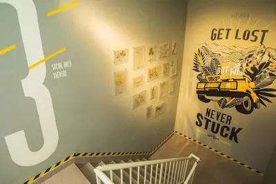 a childs room with a yellow car on the wall at Traveller Bunker Hostel 1 in Cameron Highlands