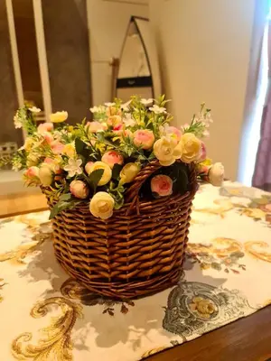 a basket of flowers sitting on a table at Sekinchan PaddyView Homestay \u9ad8\u697c \u770b\u7a3b\u7530 \u9633\u53f0\u6c11\u5bbf in Sekincan