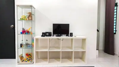 a white shelf with a computer on top of it at D'Sandra Homestay in Kulim