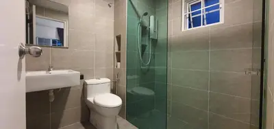 a bathroom with a toilet and a glass shower at Gerard's 