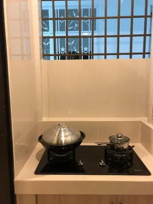 a stove with a pot on top of it at Brand New Apartment in Local Neighbourhood in Ringlet