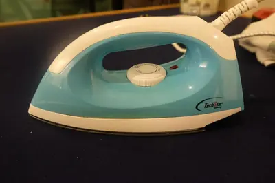 a blue and white toaster sitting on a table at Brand New Apartment in Local Neighbourhood in Ringlet
