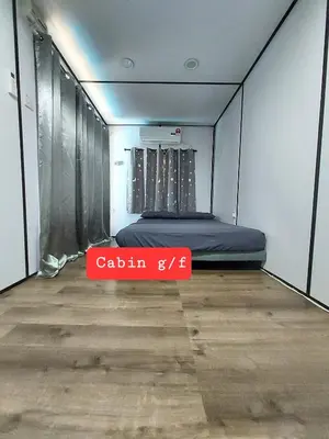 a room with a bed and a red sign on the floor at Safar House & Cabin (Muslim) in Kuala Kangsar