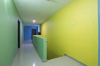 an empty hallway with a yellow wall in a room at Nova Hotel, Ipoh Tambun in Ipoh