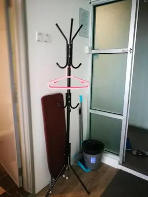 a stand with a plate on it next to a door at On Cloud 9 @ CEO by Joal in Bayan Lepas