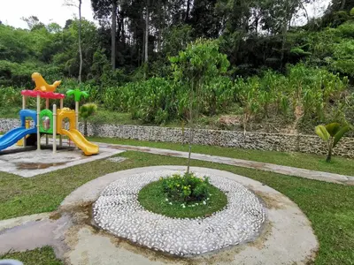 a garden with a playground and a play area at The Quintet, Tower Ethel in Tanah Rata