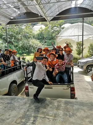 a group of people riding in the back of a truck at Moonriver Lodge in Cameron Highlands