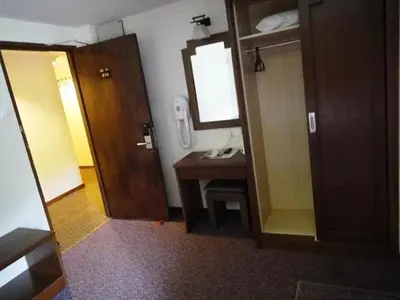 a bathroom with a sink and a mirror at Jasmine Hotel in Cameron Highlands