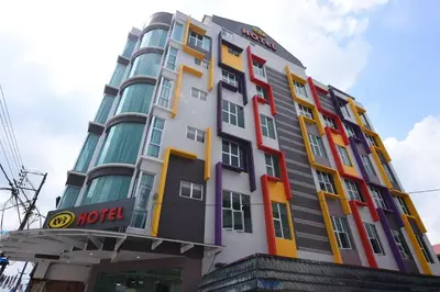 a hotel building with a hotel sign on it at KU-3 HOTEL in Tapah