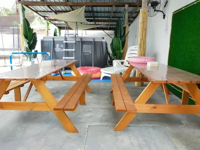 two picnic tables and benches in a patio at beXuan-Private Pool-Town Area-Snooker-BBQ-12-18Pax in Ipoh