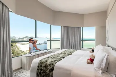 a bedroom with a large bed and a large window at Ascott Gurney Penang in George Town