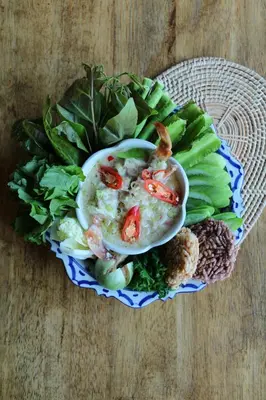 a plate of food with a deviled egg and vegetables at Victoria Garden Hotel in George Town