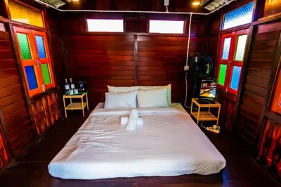 a bed in a room with stained glass windows at The Best Hotel in Bayan Lepas - THE LOV PENANG in Bayan Lepas