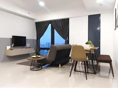 a living room with a chair and a table at Georgetown SeaView Condo Tropicana 218 Macalister in George Town