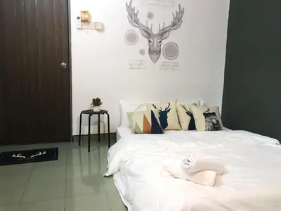 a bedroom with a bed with a skeleton on it at The Alley's @ Sitiawan, Manjung in Sitiawan