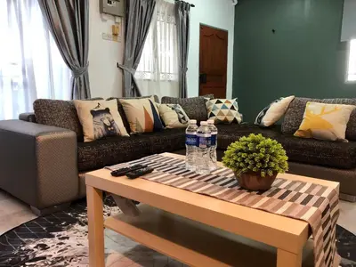 a living room with a couch and a coffee table at The Alley's @ Sitiawan, Manjung in Sitiawan