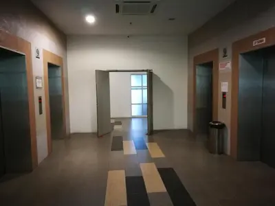 an empty hallway in a building with a door at Comfort Zone @ The CEO Loft by Joal in George Town